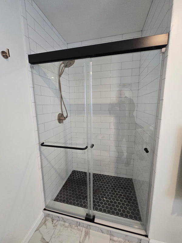 Beautiful, low-maintenance glass shower doors installed by a handyman you can trust.